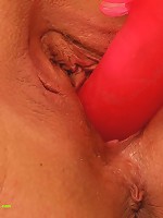 Dirty fat mom drills herself with a thick dildo