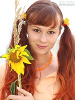 Nude pigtailed redhead