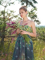 Cute chick shamelessly demonstrates her nice perky tits and her unshaved muff outdoors.