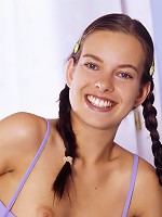 Pigtailed cute chick spreads her yummy pussy.