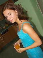 Fit, young girl takes off her dress and panties and shows her tight pink pussy.