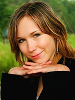 Young russian schoolgirl poses nude near river.