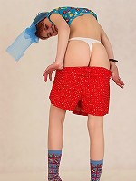 Crazy chick wears wild clothes and gets herself off.