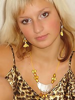 Hot Sandy has sexy tan stripes on her body and she likes to expose her big boobs.