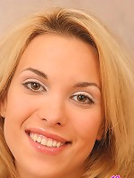 Topless Silvia pulls her panties down and poses in bed spreading her pussy lips.