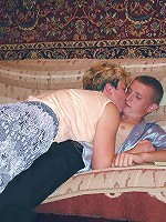 Horny mature babe joins a cute guy in the living room to dish out her eager muff