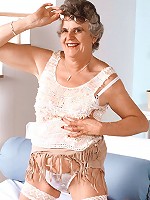 Mature model spreading her fat sagged thighs wide to expose her juicy looking hirsute cunt