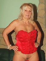 Curvy mature blonde Remy works her way into stripping off her clothes and masturbating live