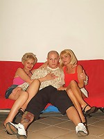 Naughty older women Rita and Rosalie enjoy taking turns in slurping and riding a dick live