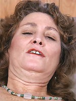 Curly brunette granny dildo fucking her unshaved pleasure hole