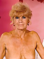 Blonde granny in sexy corset flaunting bushy box