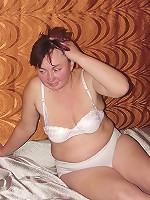 Heavyweight granny showing off in her bed