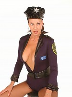 Sexy mature Vanessa Videl posing in a sexy uniform and unbuttons it to unleash her boobies