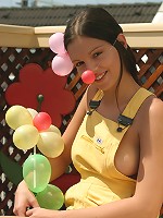 SweetEva playing with balloons in the garden