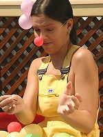 SweetEva playing with balloons in the garden