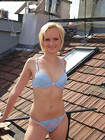 Sexy blonde teen gets naked on the balcony