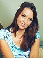 Brunette honey gets naked on the couch