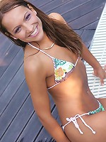 Sexy brunette by the pool