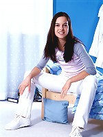 Sweet brunette slowly gets naked