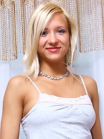 Stunning blonde gets naked on the floor