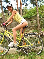Sweet and natural teen Pinky June riding bike and posing naked