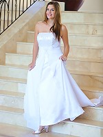 Danielle poses in a long white gown