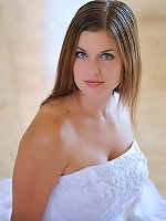 Danielle poses in a long white gown