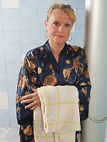 Horny mature slut playing alone in the bath and sauna