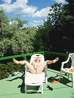 Horny mature slut playing with herself in the sun