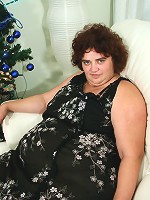 Big mature slut playing with a sausage