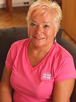 Blonde mature slut playing with her wet pussy