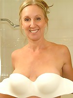 Dripping wet milf with big tits fucks a huge toy