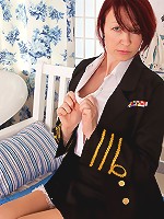 Redhead Anilos stewardess flaunts her big jugs in a bra