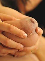 Julie milks her big natural boobs