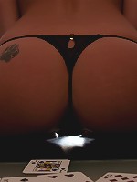 Nikki loses her clothes in a game of poker and gets mad and strips on the table