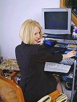 Blonde office MILF strips and spreads her ivory legs