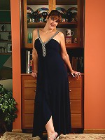 35 year old redheaded Julie slips out of her elegant dress and spreads