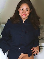 Cute brunette housewife takes a break from the laundry to strip