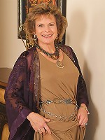 54 year old Judy strips out of her nylons and spreads her legs