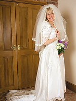 52 year old Hazel pulls off her wedding dress and spreads her ass