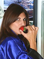Veronica N presses the juice from a strawberry with her pussy