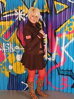 Gorgeous MILF Sally T in red panties and see through top posing