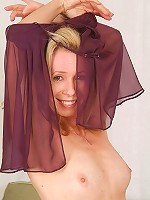 Sexy MILF Marie Kelly looks great in this purple lingerie