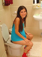 Judy sitting on the toilet