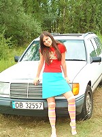 Shy brunette strips outdoors