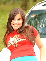 Shy brunette strips outdoors