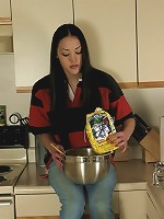 Alice gets undressed in her kitchen