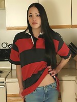 Alice gets undressed in her kitchen