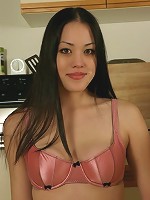 Alice gets undressed in her kitchen