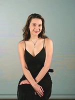 Brunette teen strips out of a cocktail dress shows huge ass